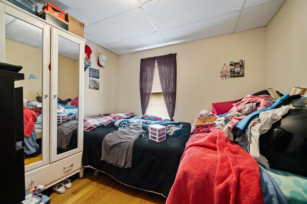 16 Barclay Street Worcester, MA 01604 - Photo 17 of 20 a bedroom with two bed and a window