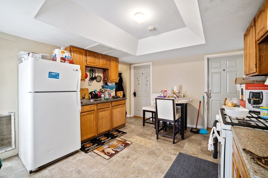 16 Barclay Street Worcester, MA 01604 - Photo 10 of 20 a kitchen with refrigerator and cabinets
