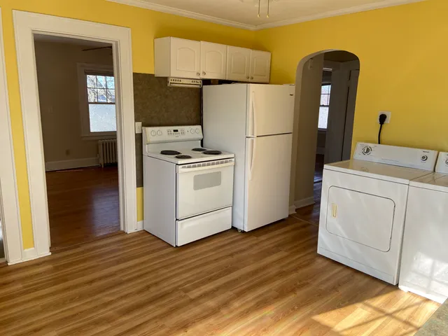 a kitchen with a refrigerator sink and stove