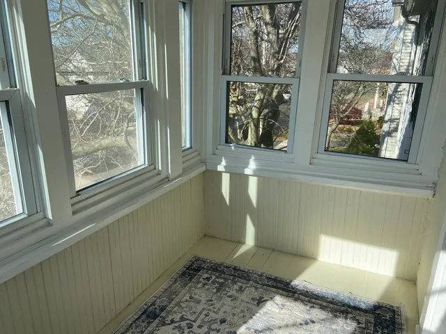 a view of a door and chair in a room