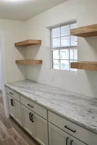 a view of a kitchen with cabinets