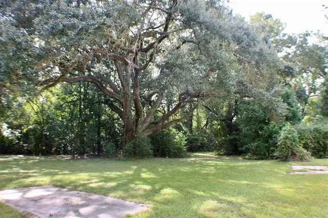 a view of a swimming pool with a big yard