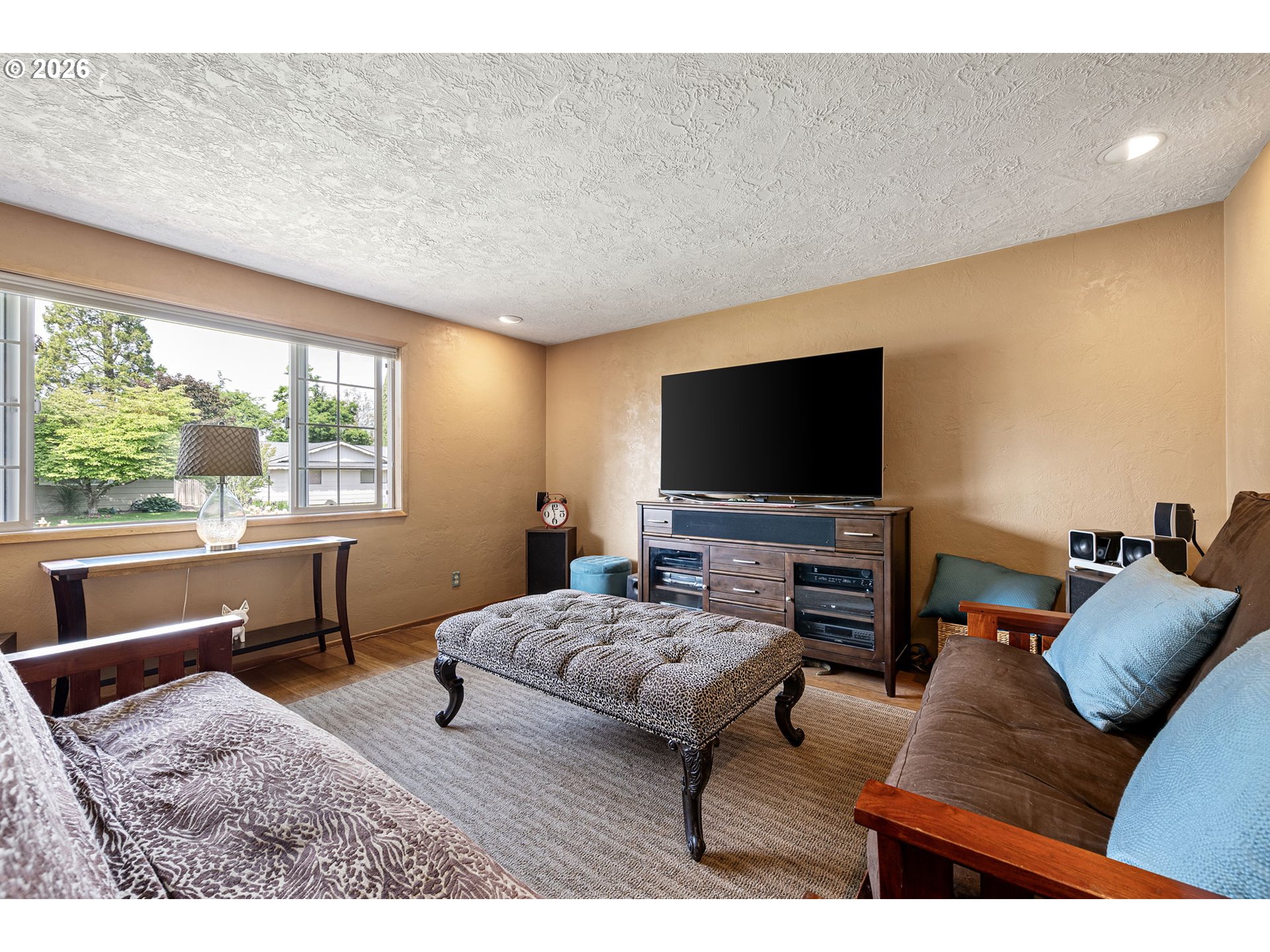2465 17th Street Springfield, OR 97477 - Photo 8 of 47 a living room with furniture and a flat screen tv