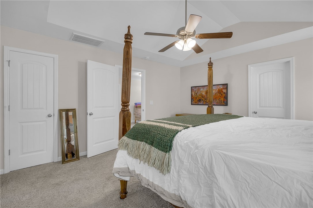 430 Johnson Road Central, SC 29630 - Photo 13 of 36 Relax in this well-lit bedroom featuring a ceiling fan and soft carpet underfoot.
