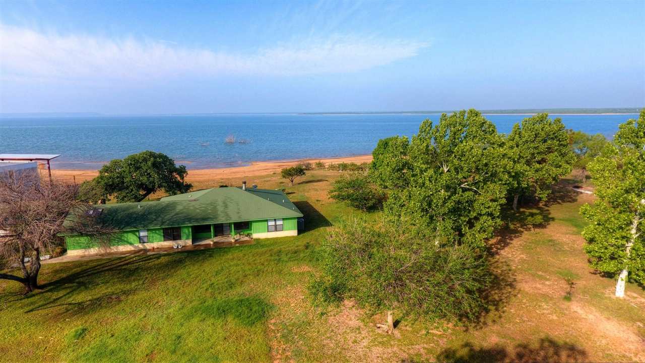 582 West Lakecrest Drive Bluffton, TX 78607 - Photo 1 of 1 an aerial view of a house with swimming pool and outdoor space