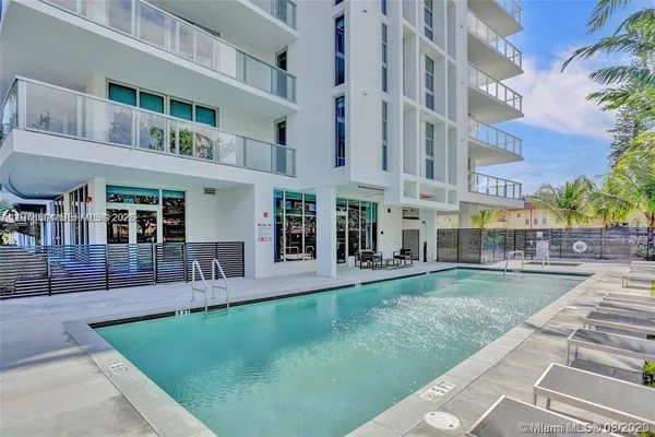 a view of a building with a yard