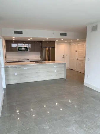 an empty room with wooden floor