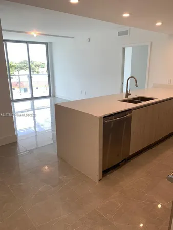 a view of a sink and a window in a room