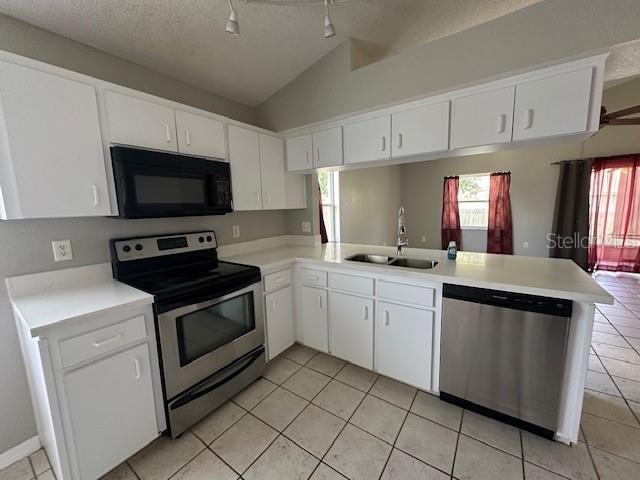 57 St Kitts Circle Winter Haven, FL 33884 - Photo 3 of 11 a kitchen with granite countertop appliances cabinets and a sink