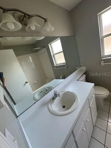 a bathroom with a sink and toilet
