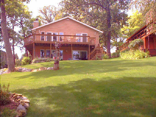 8 Lake Summerset Road Lake Summerset, IL 61019 - Photo 1 of 3 a view of a house with a yard and a large tree
