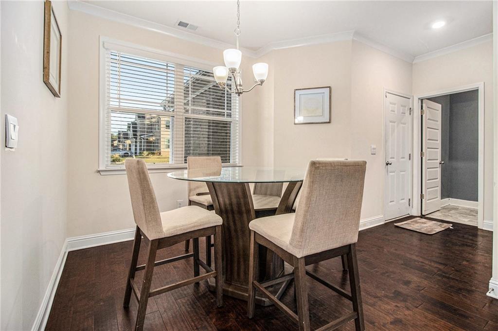 316 Conley Avenue Hampton, GA 30228 - Photo 11 of 27 a view of a dining room with furniture window and wooden floor