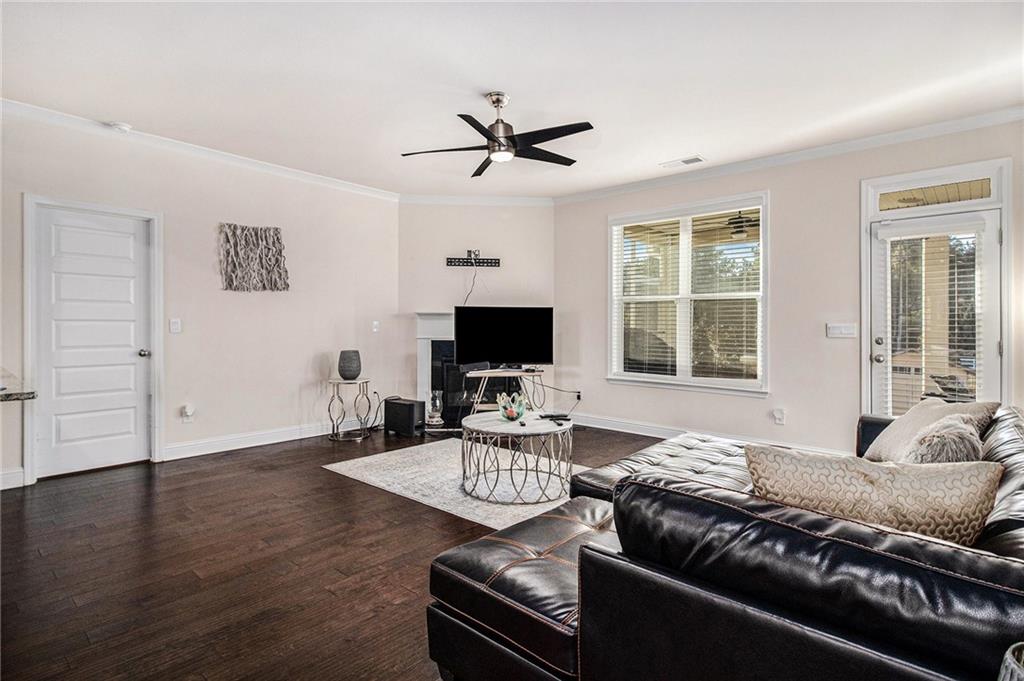 316 Conley Avenue Hampton, GA 30228 - Photo 3 of 27 a living room with furniture wooden floor and a flat screen tv