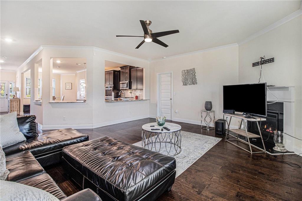 316 Conley Avenue Hampton, GA 30228 - Photo 5 of 27 a living room with furniture and a flat screen tv