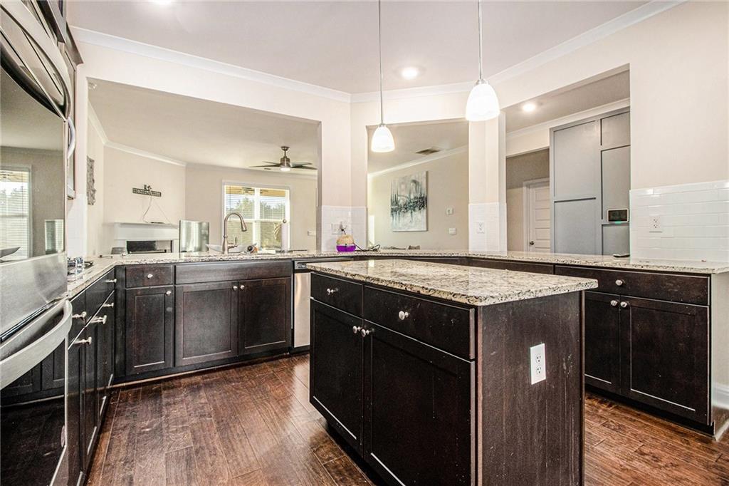 316 Conley Avenue Hampton, GA 30228 - Photo 8 of 27 a kitchen with a sink stove and cabinets
