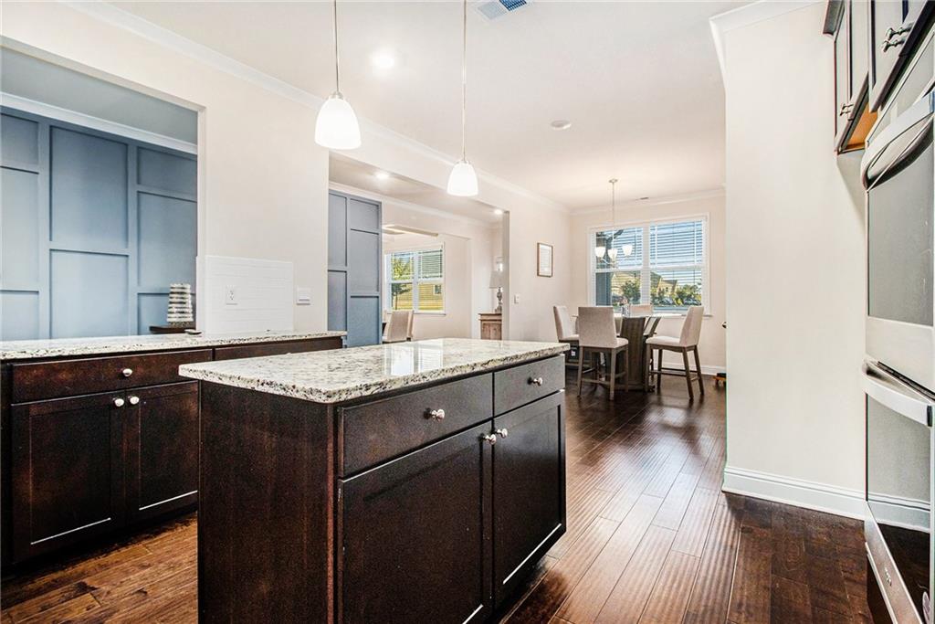 316 Conley Avenue Hampton, GA 30228 - Photo 9 of 27 a kitchen with a stove and cabinets