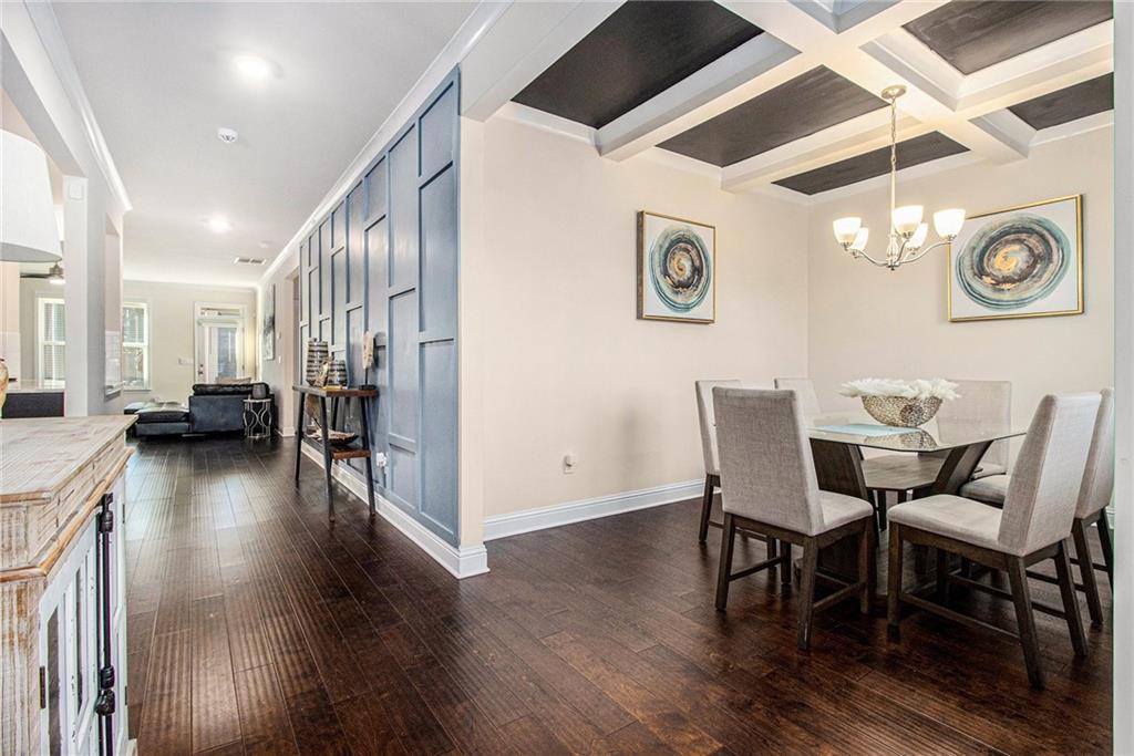 316 Conley Avenue Hampton, GA 30228 - Photo 10 of 27 a view of a dining room with furniture wooden floor and a chandelier