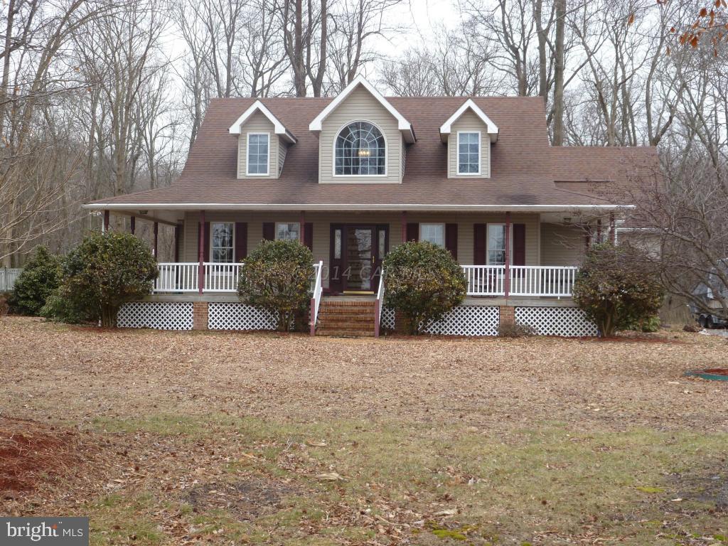 35484 Poplar Neck Road Willards, MD 21874 - Photo 2 of 15 a front view of a house with garden