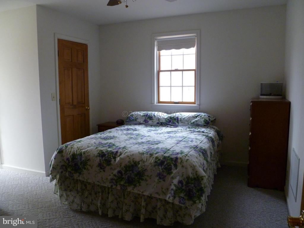 35484 Poplar Neck Road Willards, MD 21874 - Photo 11 of 15 a bedroom with a bed and a window