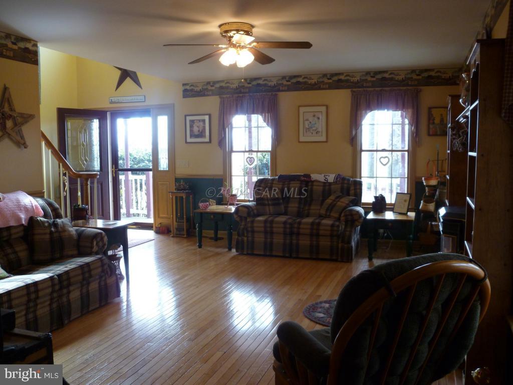 35484 Poplar Neck Road Willards, MD 21874 - Photo 15 of 15 a living room with furniture and a wooden floor