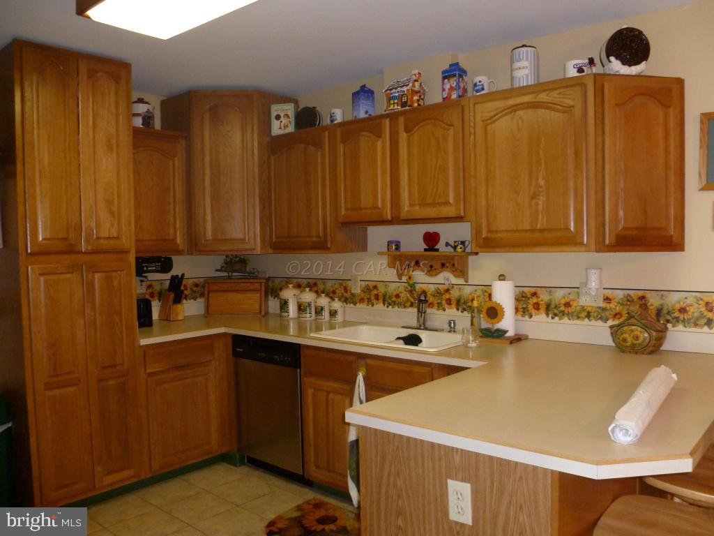 35484 Poplar Neck Road Willards, MD 21874 - Photo 5 of 15 a kitchen with a sink a stove and cabinets