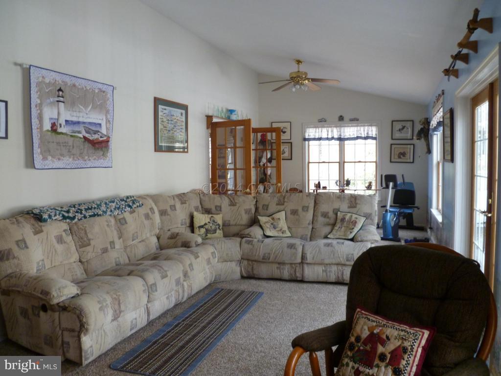 35484 Poplar Neck Road Willards, MD 21874 - Photo 6 of 15 a living room with furniture fireplace and a window