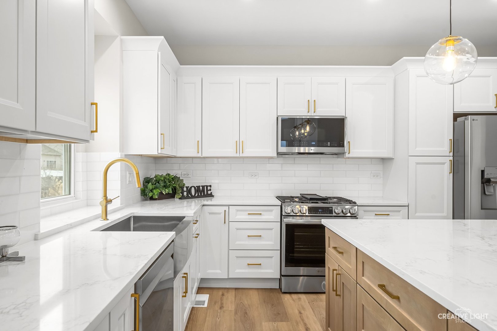 1472 Misty Lane Bolingbrook, IL 60490 - Photo 12 of 40 a kitchen with a sink a stove and refrigerator
