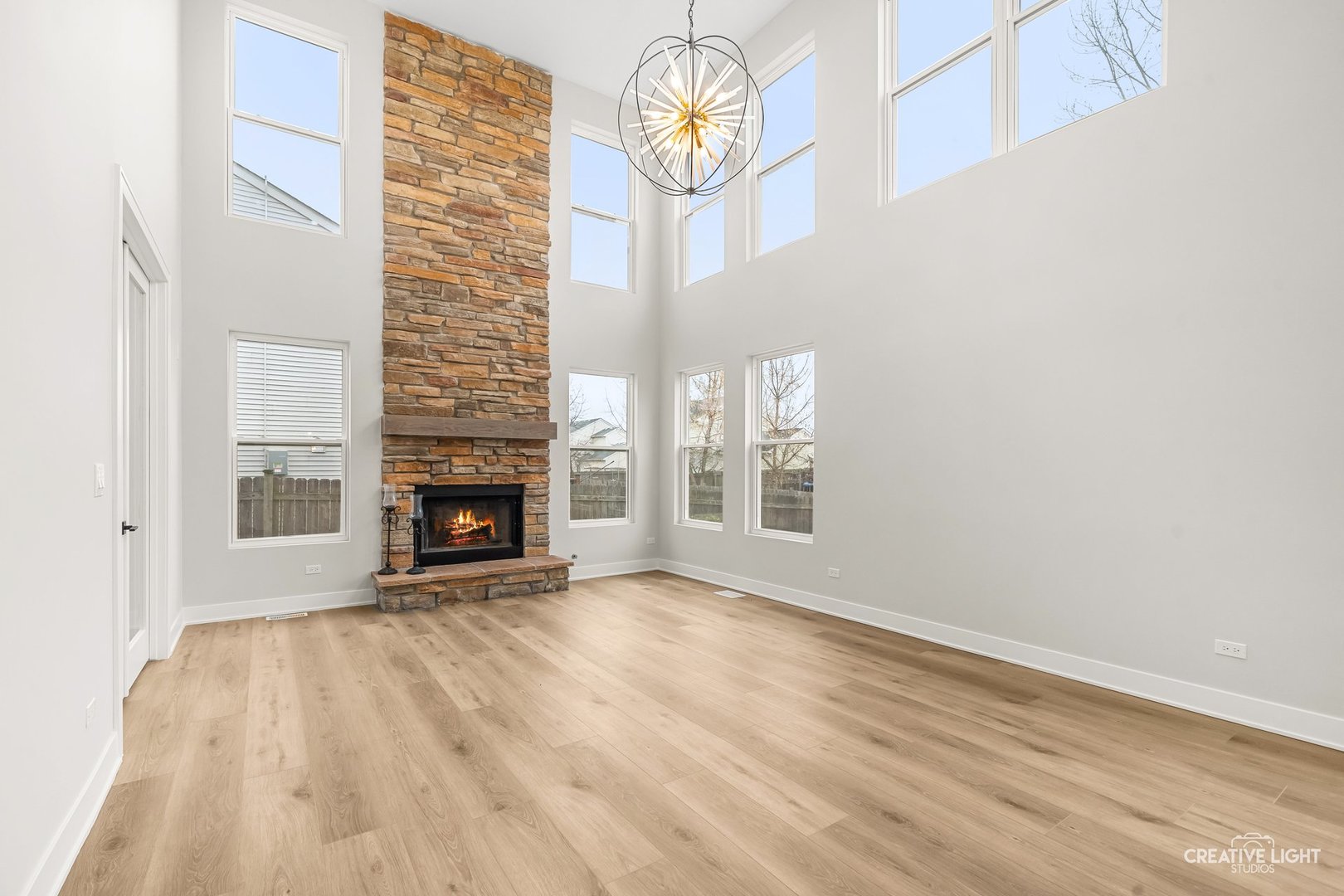 1472 Misty Lane Bolingbrook, IL 60490 - Photo 18 of 40 a view of an empty room with wooden floor and a window