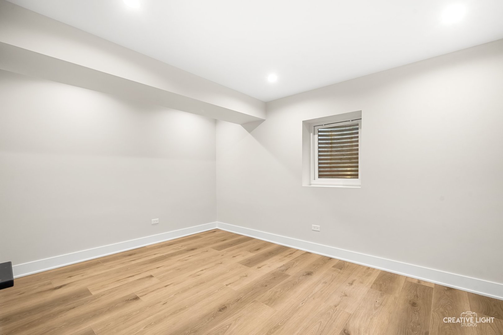 1472 Misty Lane Bolingbrook, IL 60490 - Photo 34 of 40 a view of empty room with wooden floor and fan