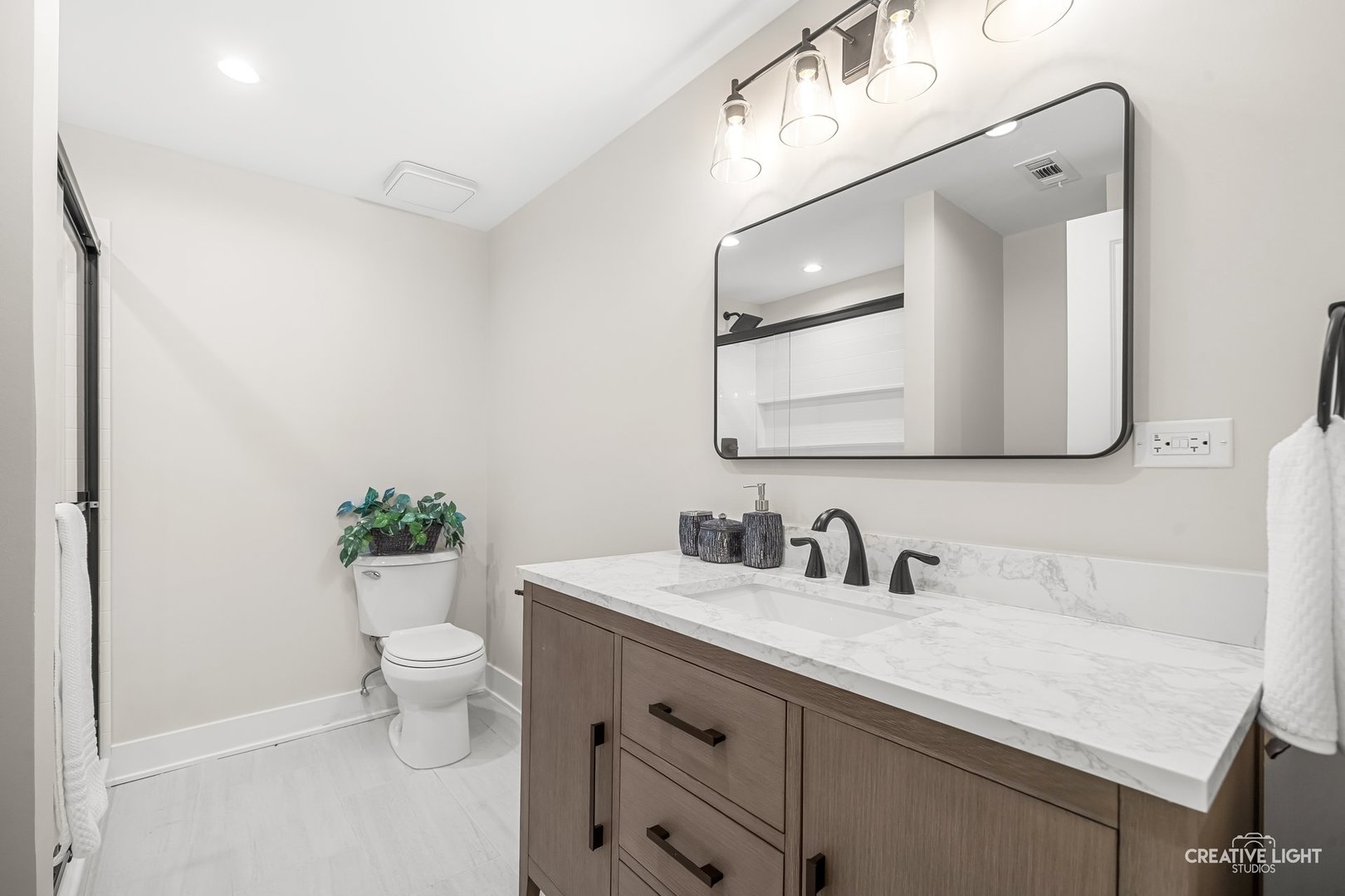 1472 Misty Lane Bolingbrook, IL 60490 - Photo 35 of 40 a bathroom with a toilet sink and mirror