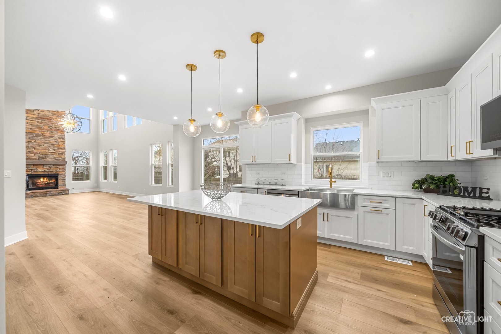 1472 Misty Lane Bolingbrook, IL 60490 - Photo 9 of 40 a large kitchen with kitchen island a sink stainless steel appliances and cabinets