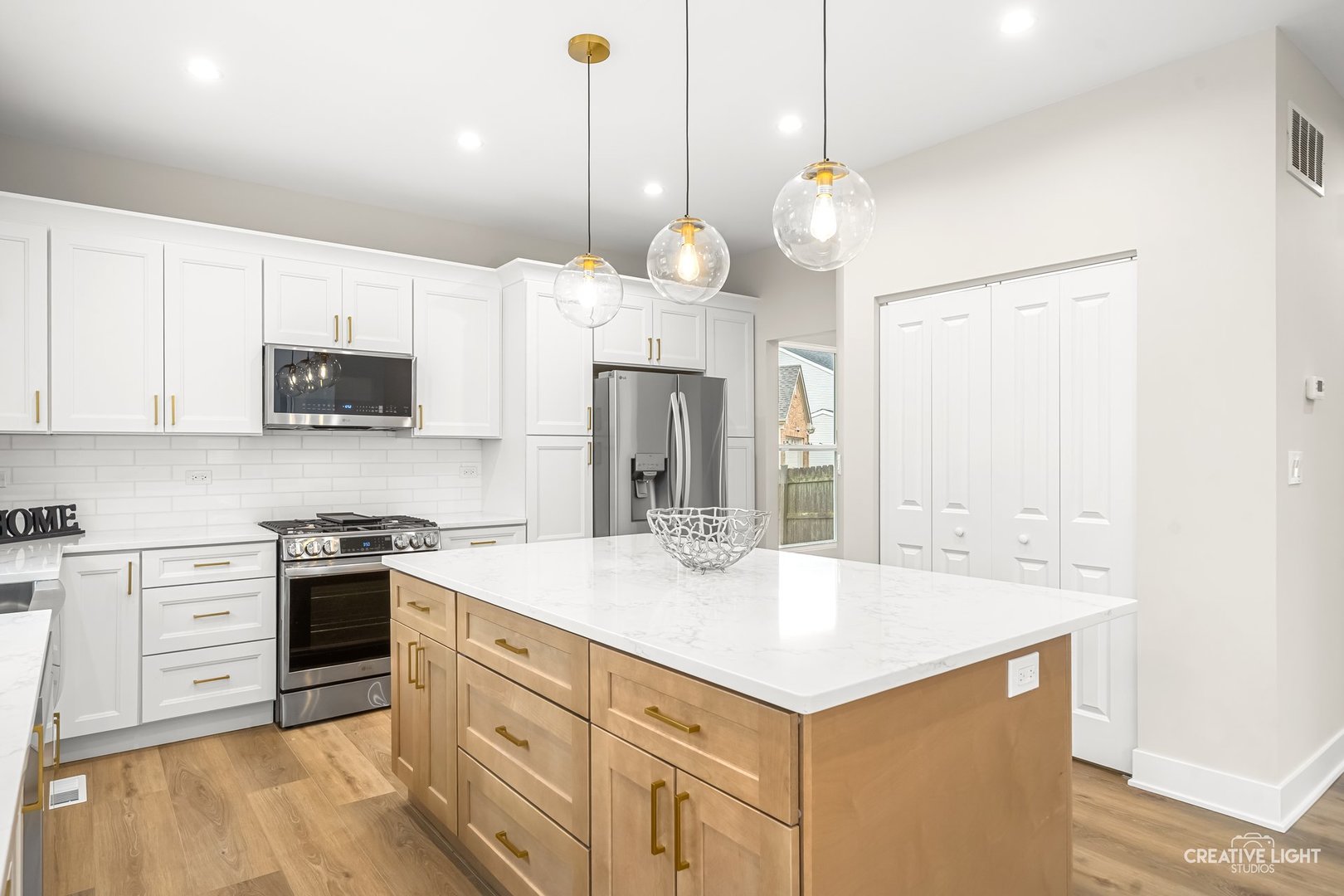 1472 Misty Lane Bolingbrook, IL 60490 - Photo 10 of 40 a kitchen with a center island appliances and cabinets