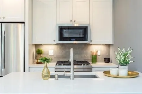 a kitchen with a stove and a microwave