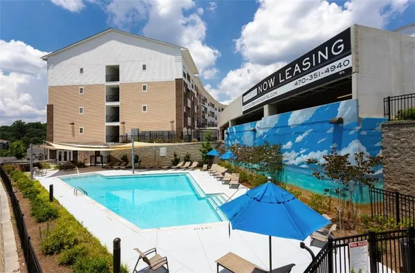 a front view of a house with swimming pool yard and outdoor seating