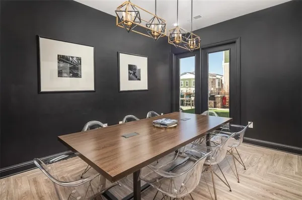 a view of a dining room with furniture window and wooden floor