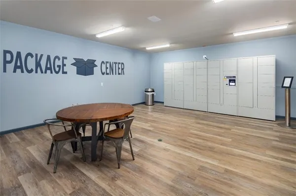 a view of a room with furniture and wooden floor