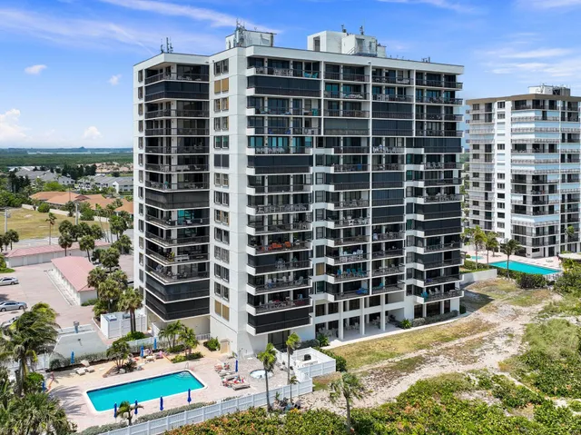 a view of a building with a swimming pool