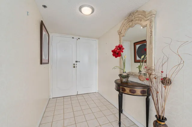 a view of an entryway with wooden floor