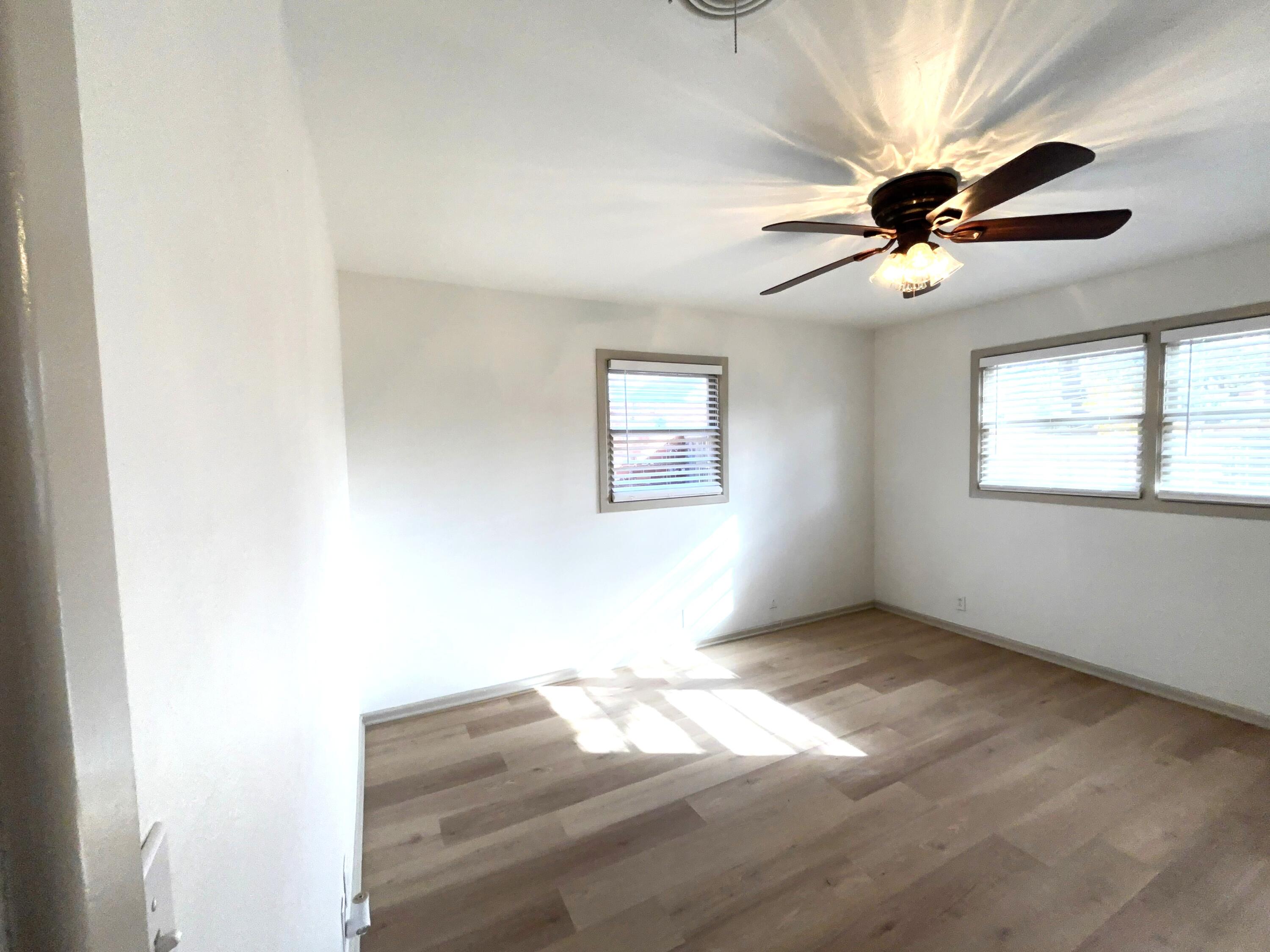 3415 58th Street Lubbock, TX 79413 - Photo 25 of 40 a view of empty room with wooden floor and fan