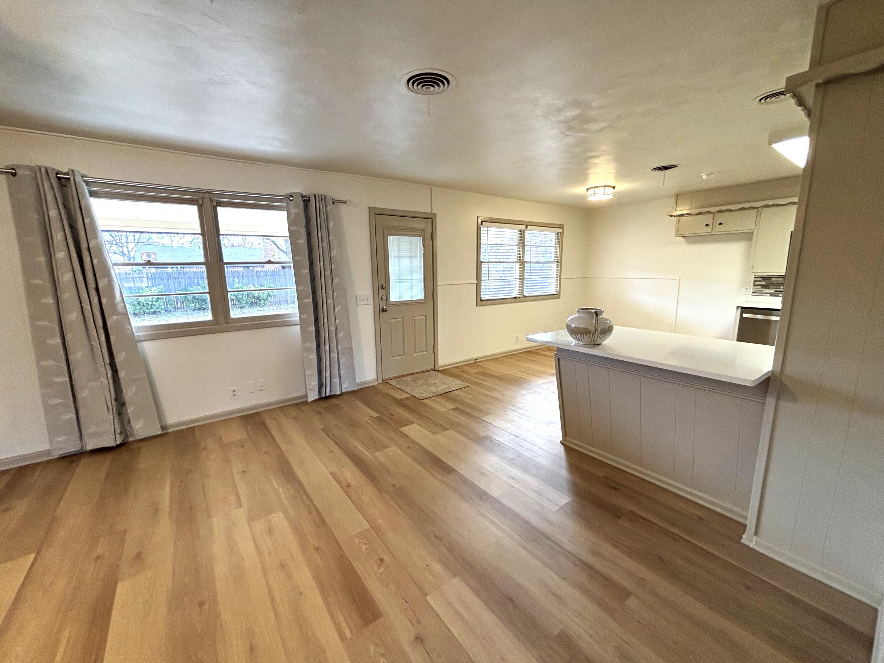 3415 58th Street Lubbock, TX 79413 - Photo 6 of 40 a view of an empty room and window