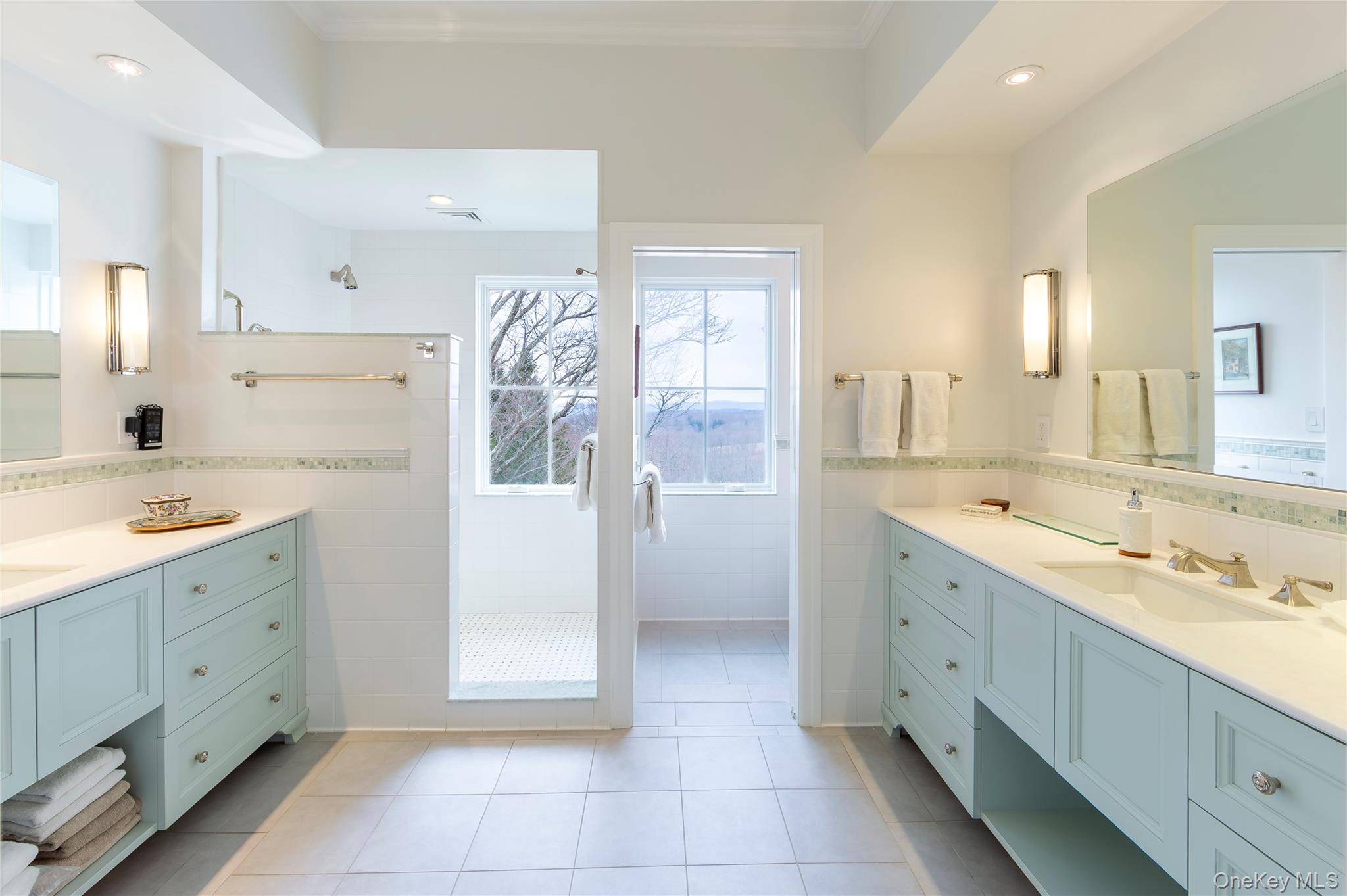 34 Meeting House Road Pawling, NY 12564 - Photo 21 of 44 a large bathroom with a double vanity sink a mirror and a shower