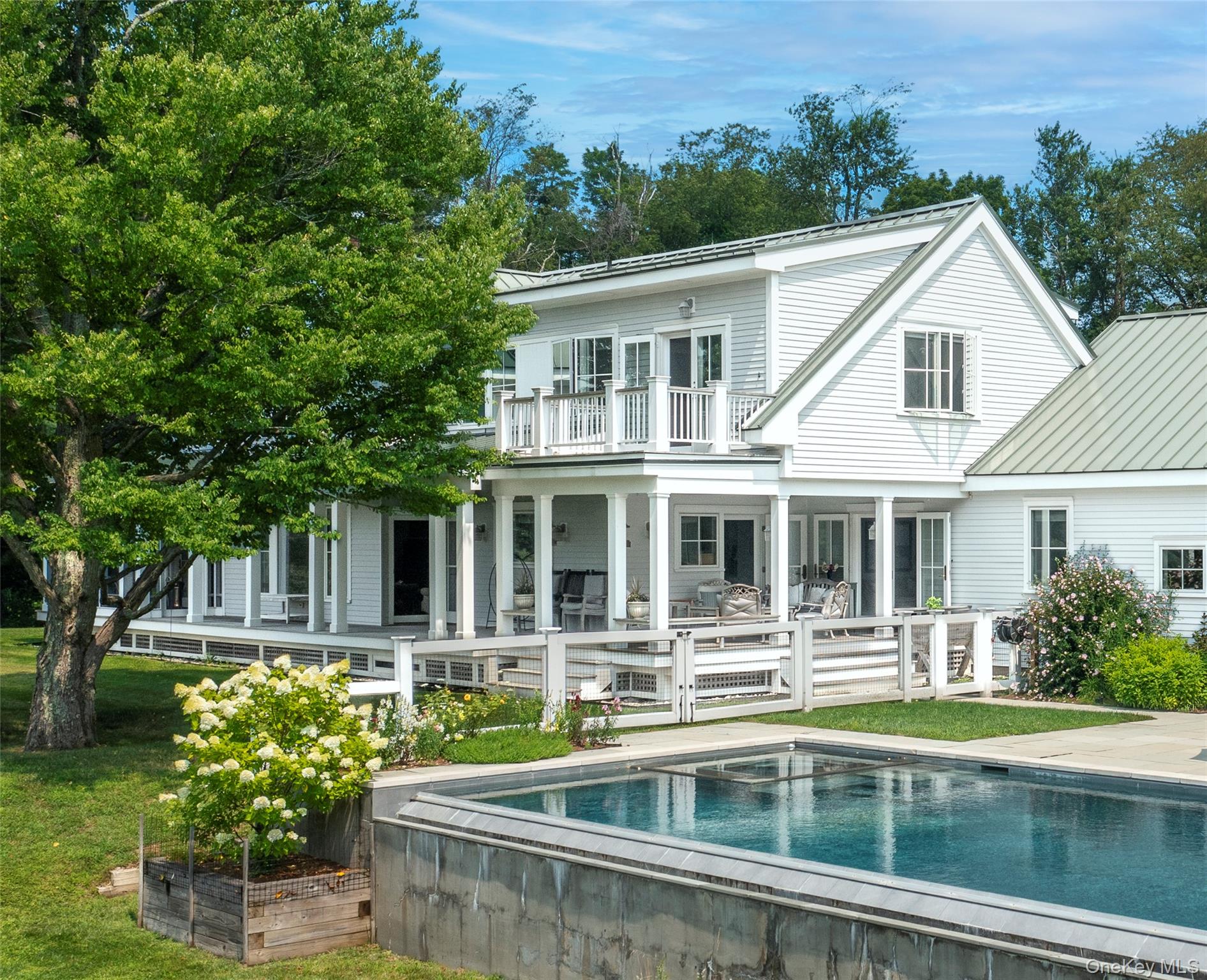 34 Meeting House Road Pawling, NY 12564 - Photo 30 of 44 a front view of a house with swimming pool and glass windows
