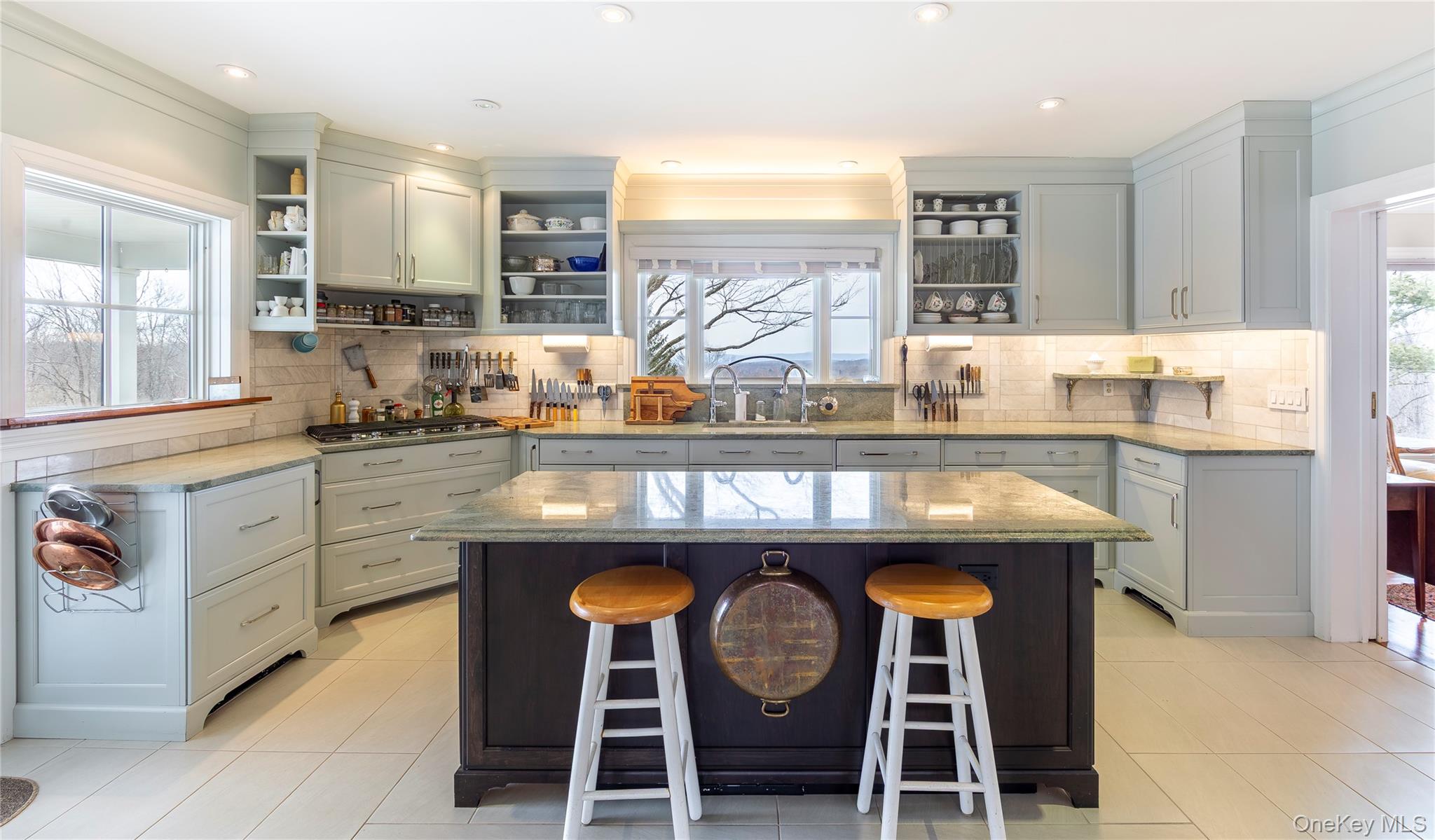 34 Meeting House Road Pawling, NY 12564 - Photo 8 of 44 a kitchen with granite countertop a sink a stove and chairs