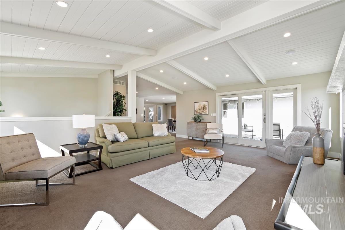 709 East Braemere Road Boise, ID 83702 - Photo 7 of 50 Vaulted ceiling with exposed beams, recessed lighting, sliding glass doors, and a partial wall separation