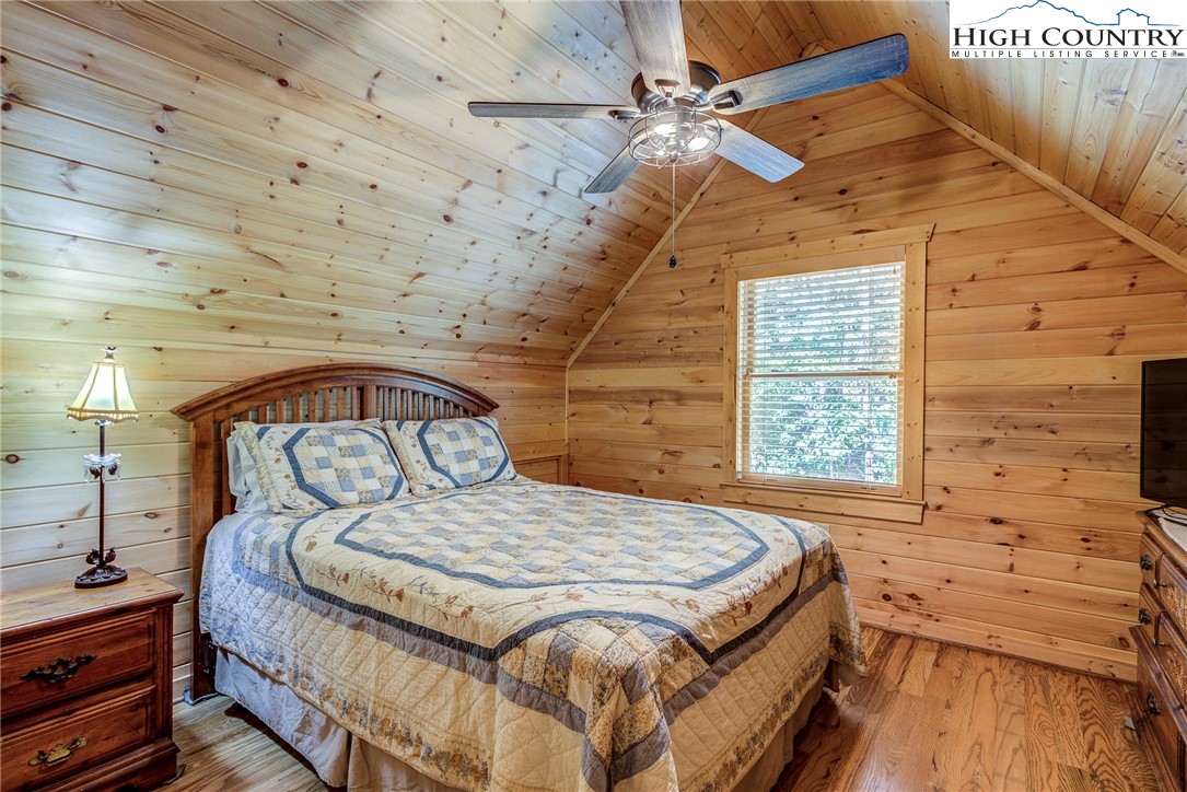 3460 South Center Church Road Thurmond, NC 28683 - Photo 39 of 50 a bedroom with a bed and a window