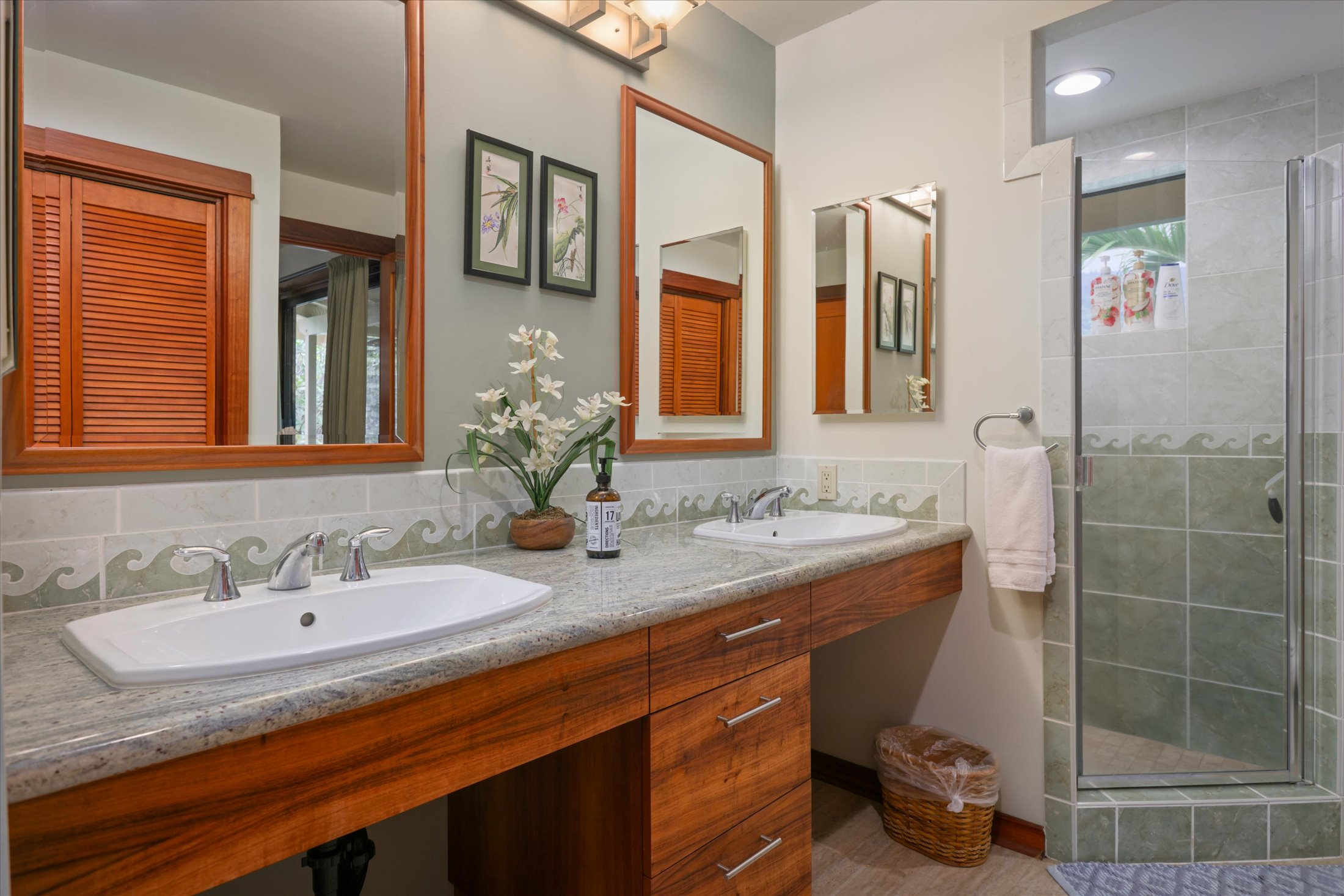 82-6289 Kahauloa Road Captain Cook, HI 96704 - Photo 15 of 29 a bathroom with a granite countertop sink a mirror and shower