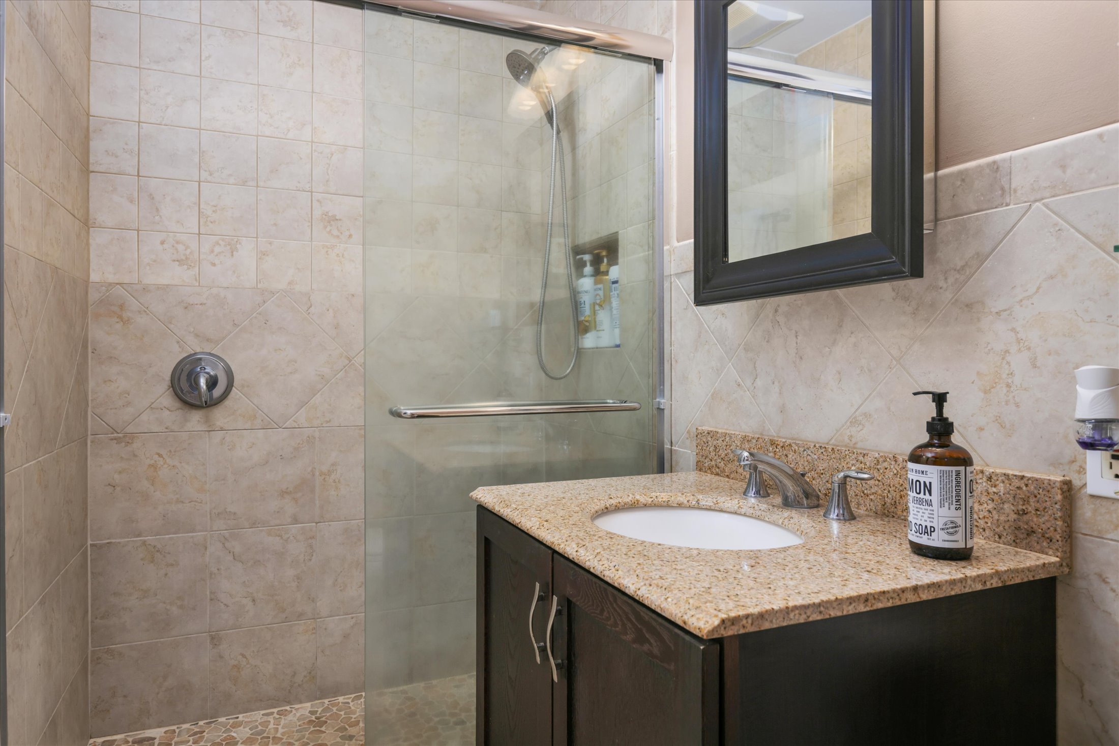 82-6289 Kahauloa Road Captain Cook, HI 96704 - Photo 18 of 29 a bathroom with a granite countertop sink and mirror