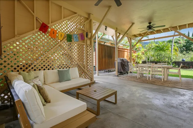 a outdoor space with the couches and a potted plant