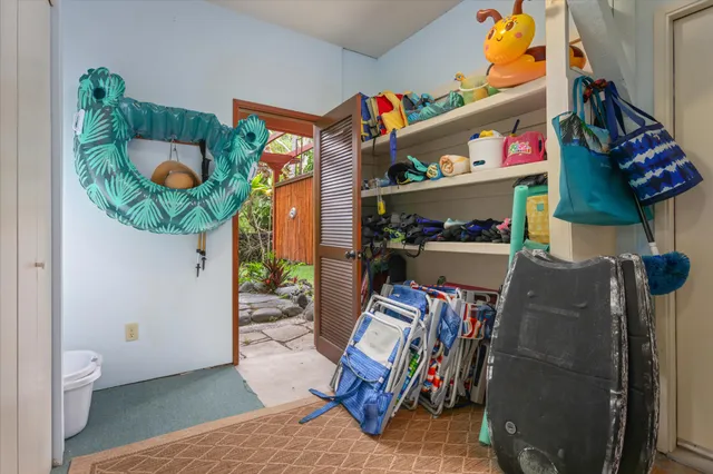 an aerial view of a house with a lake view