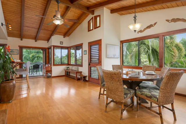 a dining room with furniture water view and a fireplace